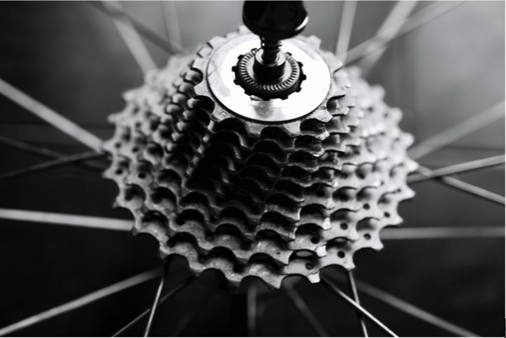 Black-and-white picture of a rear wheel bicycle cassette.